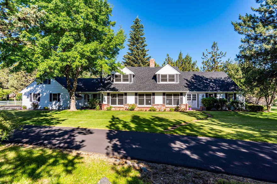 Exuding character & timeless charm, this special home offers private parklike setting with beautiful pond and Cascade Mountain views. Uniquely located close to town bordering the Urban Growth Boundary, this property is an exceptional place to live now with long term investment potential. New updates including new roof, exterior paint, landscaping, laminate wood floors, quartz counters in bathrooms & kitchen, backsplash, stainless steel appliances & carpet. Generous floor plan with great spaces to entertain including a formal dining room, living room & great room + a beautiful fireplace to tie it all together. Four spacious bedrooms downstairs with two full baths & a half bath. Oversized master suite upstairs complete with large bath & walk-in closet. Additional office/bonus room for working from home. Enjoy quiet evenings on the paver patio surrounded by mature trees, lush green grass & Cascade Mountain views. Nine acres of irrigation water available for horse pasture.