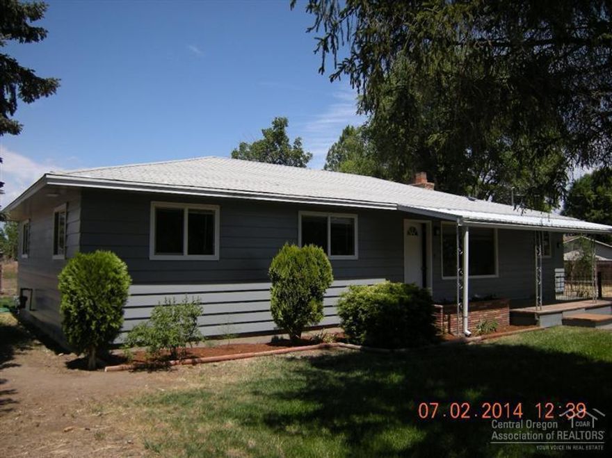 Beautifully remodeled home on a .91 acre lot Zoned R5 in well established neighborhood. New kitchen includes custom cabinetry, slab granite counters w/ tile splashes, new appliances including gas range, new gas furnace, new water heater, completely updated bathrooms, new carpet, laminate and vinyl flooring, newer vinyl windows, and blinds, electric fire place. New interior and exterior paint. It's fully fenced for animals with a barn. Bring the animals, 4-H projects, the toys and more! Turn key.