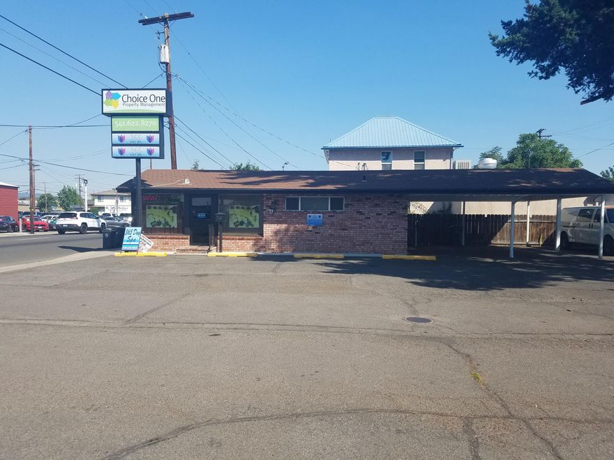 Great location close to downtown Medford with great frontage space on Riverside Avenue. Main office building is leased to stable tenant. Front building is 864 square feet and includes high ceilings, four separate rooms, one bathroom, and utility room with shower. Back unit is approximately 780 square feet and consists of one bedroom, one bathroom, an office, and small kitchen with laundry. Property has four carport spaces, five parking spaces off street, and a 2 car garage currently used as a workshop and for storage. There is a monument sign on the property as well. High business exposure where over 14,600 cars a day pass by on this one-way street heading into downtown Medford. Great investment or owner occupant opportunity!