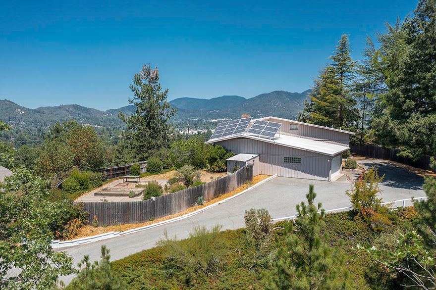 Fabulous 50's Flipper! Nearly 2900 s/f, 3 bedrooms, 3 full baths, incredible 'Hill Top' views over Grants Pass & surrounding mountains. True to the period w/ butler's pantry, banquet room, built-ins, gorgeous hardwood floors, real brick (likely the last of the locally fired/Hays Hill Brickyard!), glass block, brass (looking) knobs, tile countertops, solid wood cabinetry & all appliances, mudroom w/ w/d. Oversized finished/ins. 2 car garage w/storage & shelving & another large bonus room w/ built ins. 2 water heaters. Energy Efficient w/ Solar Panels to Lighten your Load. Durolast Roof. New heat pump. Electric insert in Fireplace. Natural gas available. Many dbl pane vinyl windows including large slider out to deck .77 of an acre zoned R-1-12. Room for ADU. Fenced yard, shed, concrete patios & pathways; owner filled in the inground pool not too long ago (!) Might be able to exhume & have operating again if Buyer desired. Gated & private. Evergreens & Established landscape. Appt Only.