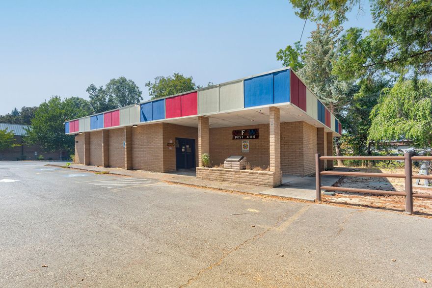 Now is your chance to own an iconic building in the heart of desirable Rogue River! For the past 77 years, the VFW was located here-this creekside building is ready for new owners. Full commercial kitchen, parking for 25+ vehicles, outdoor patio with covered area and stage. Spacious entry leads to large dining or event room along with 2 restrooms and office. The ''canteen'' lounge includes full bar, seating space, 2 additional restrooms, kitchen with griddle, deep fryers, 3 compartment sink, sandwich station, newer commercial vent hood, and separate oven. There is an additional huge walk in cold storage, 2 dry pantries, and ice machine. Outside the partially covered patio is flanked by Ward Creek however fenced for privacy. Two storage buildings and a covered carport complete the outside. Potential possibilities include Restaurant, Bar, Dance Club, Event Center, you name it!  Centrally located in Southern Oregon between Medford and Grants Pass your next investment opportunity awaits!