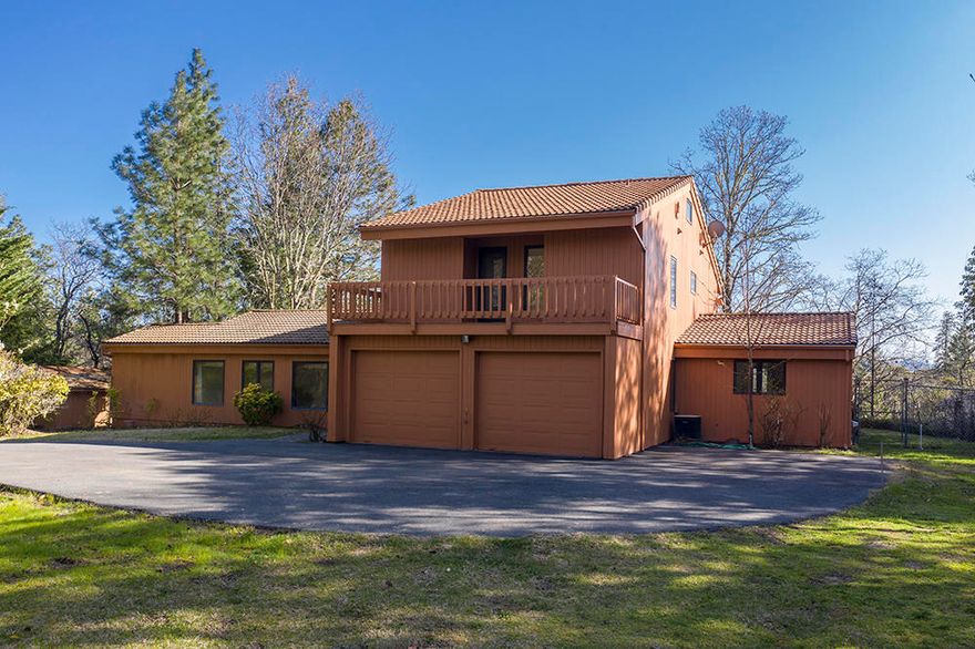 LONG distance views with peace and tranquility..........this custom home sits on 20+ acres at the end of a long asphalt drive. With over 2500 square feet the south facing home is perched amongst the pines. The house has 4 bedrooms with a primary room on the main AND a primary on the 2nd story, 3 1/2 baths. The living room is cozy with a sunroom and there is a great kitchen and formal dining. Built in 1989 by the current owners and lovingly cared for thru the years. The roof is a lifetime tile roof. There is a 2 car garage that is attached as well as a boat or extra car storage building separate from the house as well as a garden shed. Lots of BLM land is around the home which adds to the privacy and serenity of the setting. Recent painting and updates in the bathrooms and new carpets. Lots of storage and located 15 min from town.