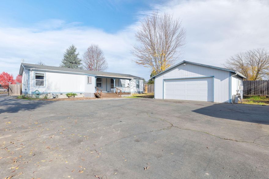 Priced to sell! Welcome home to the best of both worlds, close to town, yet tucked away in your own private, gated haven at the end of a quiet cul-de-sac on a fully fenced 1/3 acre lot. This 3 bedroom, 2 bath home has been thoughtfully updated with a newer roof, remodeled kitchen, updated bathrooms, and newer laminate flooring, making it move-in ready from day one.

Inside you'll find an open, split floor plan with vaulted ceilings and natural light. The spacious primary suite features a walk-in closet and a double-sink vanity for comfortable daily living. The remodeled kitchen offers a large island, walk-in pantry, a dual-fuel range, and plenty of cabinets to keep things organized. 

Outdoors you can relax on the covered porches, garden, and enjoy the beautiful scenery. Bring your RV, toys, or hobbies because there's space for those too. Zoned R-3, the property also offers potential for an additional dwelling (buyer to do their due diligence).

Must see to truly appreciate!