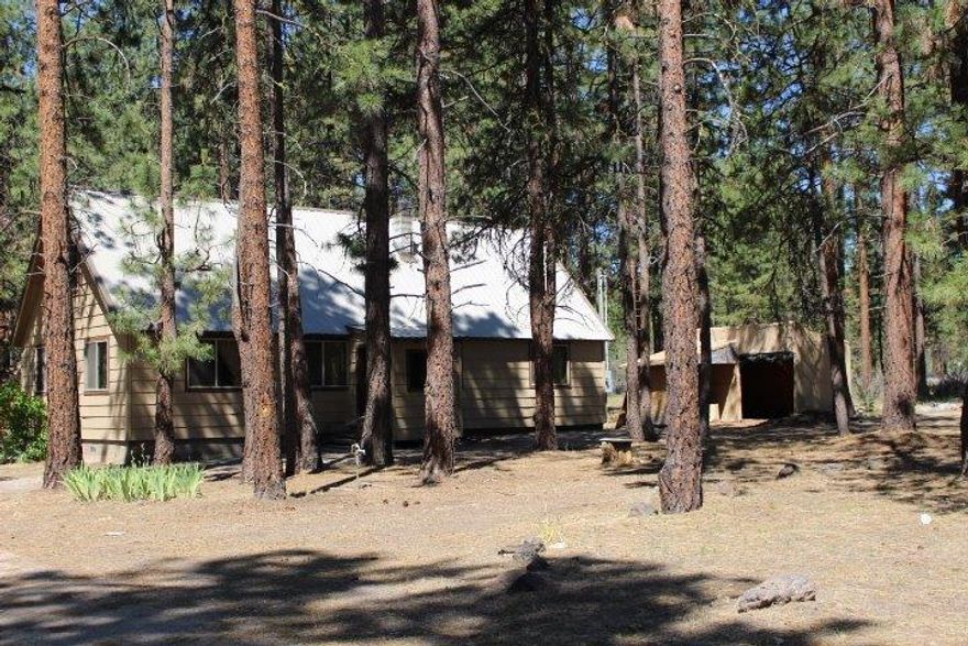 Great location in the pines! This 3 bedroom 1 bath home is just off the main road. It offers a total of 2116 square feet. The down stairs is 1284 square feet and the partially finished upstairs comes in at 832 square feet. Low maintenance metal and updated vinyl double pane windows. Come make this house your own. This home is being sold in as is condition.