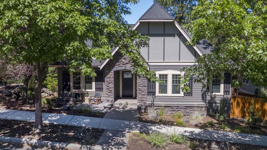 This charming home is in the heart of one of the most sought-after areas of Northwest Crossing, just a short stroll from High Lakes Elementary, Lewis & Clark Park, & all the amenities of Northwest Crossing. Step inside to a warm & inviting living area with beautiful hardwood floors. Don't miss the floor-to-ceiling bookcase hiding a secret closet! The kitchen has stainless steel appliances, granite countertops & custom cabinets. The deck is a private retreat nestled in the pines, offering peaceful views of Awbrey Butte. Three bedrooms are conveniently located on the main floor, and just a few steps up you'll find the expansive primary suite with soaking tub, tiled shower and a dreamy treehouse feel. Downstairs you will find a separate office or guest suite with private entrance - perfect for visitors or a home office. Additional highlights include an oversized garage with ample storage and an extra parking pad adjacent to the alley. Don't miss the chance to make this gem your home!