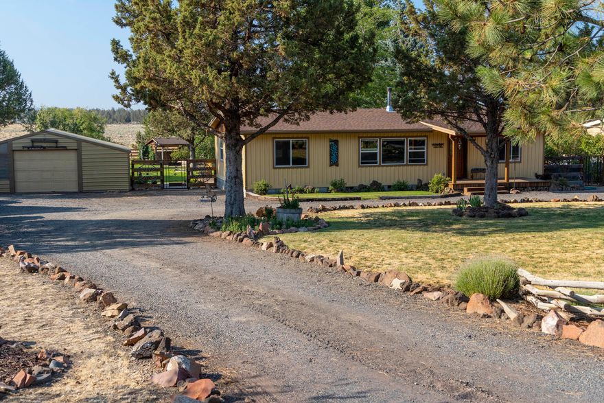 SO MUCH TO OFFER! Home is approximately 1554 sq ft, and every inch has been upgraded in some way! Flooring is laminate & vinyl wood-look planking. Master has custom tile walk-in shower and well-finished wood counter with vessel sink. Guest bath has tub/shower, with tile surround. Kitchen was totally remodeled, with hickory cabinets, tile countertops, island, micro, glass-top range/oven & dishwasher. Six panel pine doors, trim and knotty pine walls have been added, along with new entry-door. A sunroom or dining room, with wall of windows, has been added, as well as pantry/mud room. Outside you will enjoy a lush green lawn, raised beds, vegi garden & underground cold storage with a perfect children's playhouse above. Back of property has corral & barn with stalls & chicken coop. All this adjoins a 90-acre pasture w/2-mile walking trail, park & room to ride your horse, providing an unobstructed view of the Cascades. You must see to believe the quality of construction, from top to bottom!