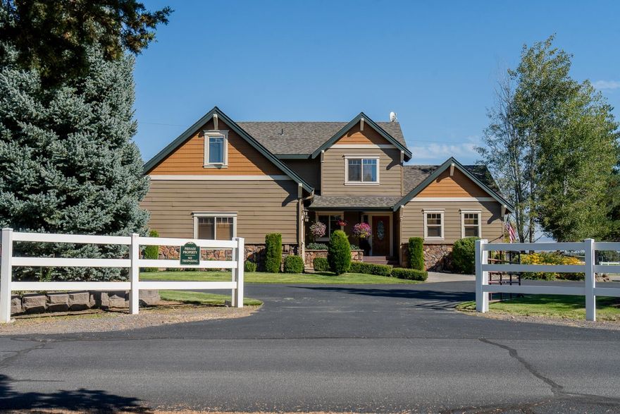 This picturesque 39-acre farm offers a rare blend of income potential and peaceful country living. With 36 irrigated acres, including 31 acres of premium horse hay yielding 80-100 tons annually, the property is well established for agricultural success and supported by long-standing water rights and a canal running along the northern boundary. The main home features floor to ceiling windows framing sweeping views and a primary suite on the main level. Lovingly maintained grounds include gardens, fruit trees, and tranquil ponds that reflect the surrounding beauty. Equestrian facilities are exceptional with a 100x80 barn, stalls, tack rooms, office, paddocks, wash stations, and round pen. An established horse hotel and income-producing Airbnb add opportunity, while a spacious workshop, RV hookups, and irrigated pastures complete this offering. A rare chance to enjoy both beauty and business in one extraordinary estate.