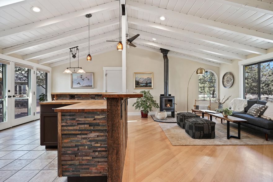 Upper Tumalo Rim oasis awaits it's new owners. Pride of ownership is evident throughout this quiet peaceful property including the thoughtful ecologically-minded landscaping on the flat 1.2 acre lot to the renovated 1,240sf main house and detached RV garage (670SF) w/ office suite. The cozy single level open floor plan in the main house allows for natural light to fill the kitchen/living room area.The vaulted ceiling, maple hardwood floors, kitchen island, and wood burning stove compliment the space.Expand your living area by capturing views of the Cascades on the large private West facing paver patio or meander over to what the Seller's refer to as the ''Casita'' built in 2016.The permitted office suite (648SF) has a full bathroom and wet bar.The picture windows create a light airy space with beautiful views; great for remote working or just relaxing. Perched above Tumalo State Park, 5 min drive to Shevlin Park/10 minute easy drive to downtown Bend, this property is truly special.