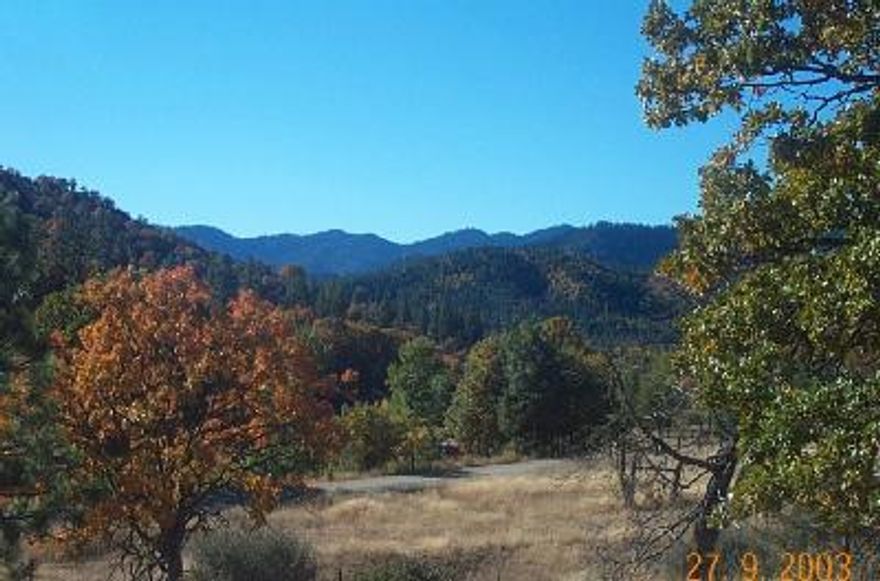 Beautiful building site in the Colestine Valley, just 25 minutes to downtown Ashland. Moderate slope, good southern exposure, power and phone close by. Non-expiring homesite approval. Excellent well area. Seasonal creek and gorgeous Winter waterfall. Adjacent to the former site of Rising Sun Farms.