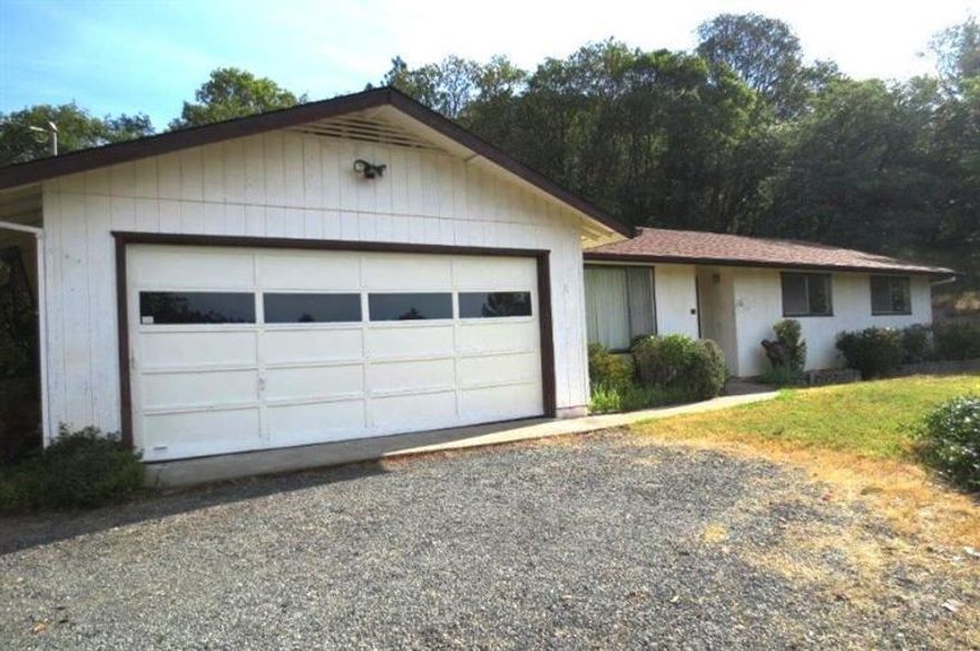 Private wooded setting in the North Valley area. Featuring a spacious 3 bedroom, 2 bath ranch style home with 1632 sf. Spacious home was built in 1977 and is all original inside. Step down living room, separate family/game room. Kitchen has pantry and large dining area with bay window. Wonderful family home with an abundance of storage; an attached two car garage and covered carport. End of the road privacy with paved driveway and RV parking. Plenty of room for your garden and animals on 5.05 acres. Roof was replaced a few years ago. Close to town and shopping. Low County taxes. Current well flow at 5 GPM after 4 hour test. New pump going in.