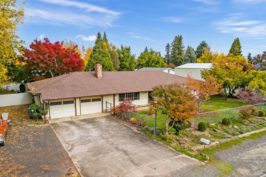 A wonderful single level home in SW Medford!  This is a spacious 1708 sq ft home with three bedrooms two bathrooms on .33 of an acre. The floorplan is open and bright with large picture windows and a large living room with brick fireplace. There is an oversized kitchen that steps down into a separate family room. The family room has a slider out to the back concrete patio and to the large backyard. It is very private with a fully fenced yard, large garden area, and a large RV parking area. A must tour property! Very easy to show.