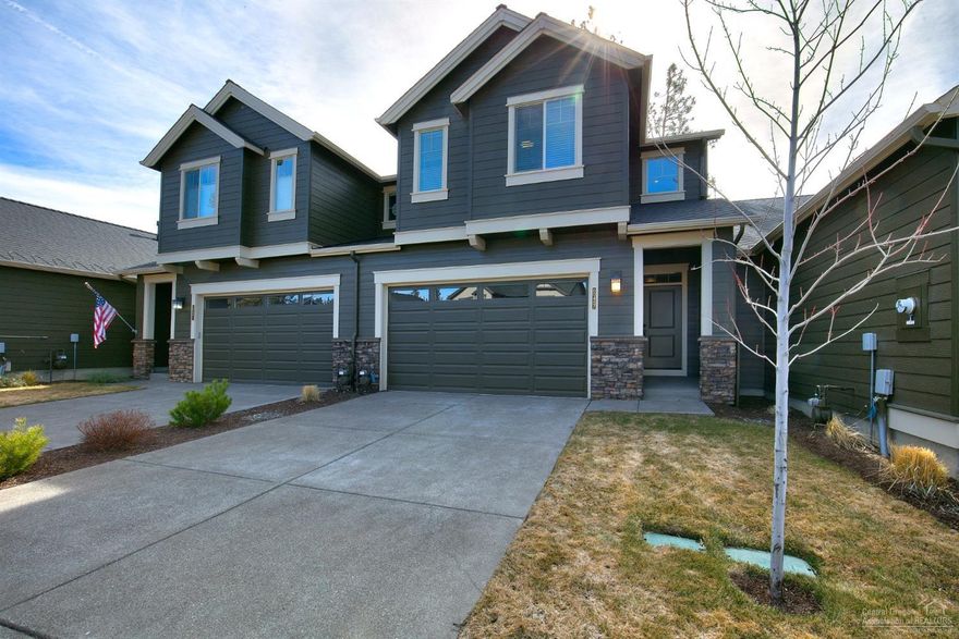 You'll love this beautifully crafted and immaculately maintained Pahlisch townhouse in the highly sought-after Stonegate community in SE Bend! Lots of natural light throughout. This two-story home lives large. Open concept living on the main floor complete with a gas fireplace, laminate wood floors, quartz countertops, KitchenAid stainless steel appliances, breakfast bar and separate dining area. Upstairs, the spacious master suite features a large walk-in closet, oversized shower and double vanity. Two nicely sized bedrooms share a full bathroom with tub/shower combo. Large laundry/utility room. Sit back and relax on your private, fully fenced and landscaped backyard patio. No rear neighbor and private gate that opens up to paved paths and shared community space. Stonegate amenities include clubhouse, pool, hot tub, covered BBQ area with fireplace and more. This home won't last long schedule a showing before it's gone.