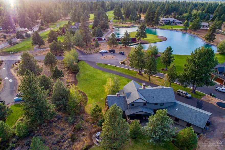 Beautiful Custom Home on over 1 acre located on the Signature Hole of Lost Tracks GC. Build and finish quality must be seen to truly appreciate. Floor plan works for a variety of buyers with Main Level Master. Large entertaining/bonus room with Golf Course and peek a boo mountain views, complete with its own bar. Two separate offices make working from home easy. The outdoor space provides a large, flat grassed lot in front of the home and an entertainment area in the back complete with bar, smoker, tv and firepit.