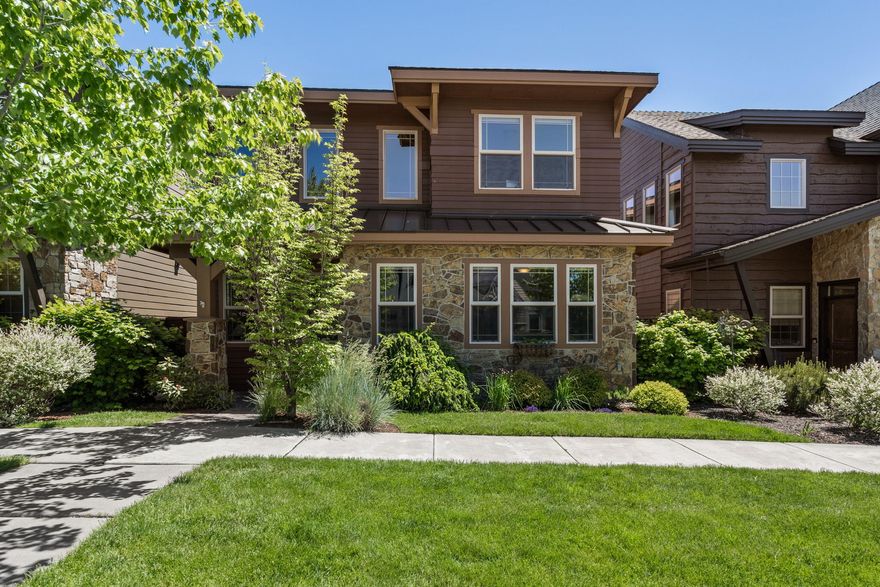 This beautifully built home features exceptional craftsmanship and high end finishes. Dark distressed wood flooring creates a rich contrast with an upgraded wood interior door and window trim package and custom built cabinetry. Chefs kitchen has slab granite, undermount sink, GE Profile SS appliances, five burner gas range on island/eating bar. Elegant master bath has oversized soaking tub, tiled shower and double sinks. Very private courtyard and hoa that takes care of the landscaping and snow removal. Great community park and pool with easy access to the river trail. Come see if this is the home for you.