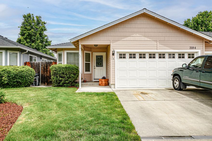 This zero lot line home has a great location. Single level 3 bedroom, 2 bath home built in 2005. Laminate flooring throughout, tile flooring in kitchen & bathrooms, newer appliances, private covered patio off primary bedroom and a two car garage. The floor plan is open and bright with a front bay window. HOA fees include front landscape and outside water. New exterior paint in 2019. HVAC serviced twice a year.