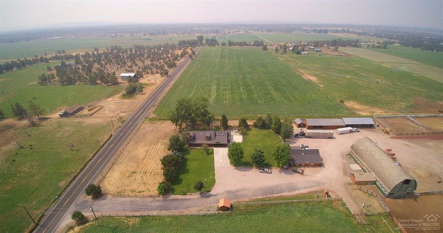 Panoramic Cascade Mtn. & Smith rock Views surround this amazing quiet ranch setting on 103.90 acres w/75 Irrig. 2 permitted residences. Main home features 4 bed/3 bath, 2923 sq ft. Hickory hardwood floors, country kitchen, open floor plan, 2nd home 1464 sq ft 2 bedroom 1 bath. The property is set up for livestock, hay ranch or horses, 4 ponds, 5 feedlot pens, arena, horse pens, 5 fenced pastures, machine sheds ,shop,  new Zealand fencing. Historic Barn. Hunter's, 2 buried duck blinds,1/2 mile to BLM. 5 Miles North of Redmond, 2 tax lots with separate addresses, TL 500 and TL 600. Machine shed with 7 bays, fully fenced and crossed fence. Orchard grass hay fields, pasture with wheel lines and gated pipe. Great property for wedding venue's, equestrian, crops, agriculture , cattle or hay ranch. Also Bird hunting revenue.