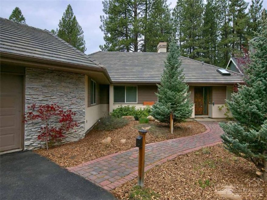 Nice single level home backs to the Widgi Creek golf course. Open floor plan with a fireplace, big windows and wet bar in the living area. The kitchen features a propane cook top, double ovens and tile counters. Formal dining room plus a breakfast nook. The spacious master suite has two walk-in closets, a spa tub and step-in shower. There are two decks - one off the living area to sit and enjoy the view and a separate deck located off the kitchen. Big .47-acre lot with easy-care natural landscaping.