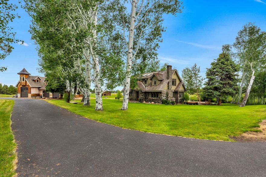 14.86 acres bordering Tumalo Reservoir with Mountain Views. This is a rare opportunity to own Central Oregon history. The house was built in the 1930's and has only had 2 owners. The seller expanded and updated the original house to fit his growing family. There is extreme pride of ownership in this classic stone farmhouse. New flooring downstairs, recently remodeled bathrooms, redwood back deck, 3 irrigation ponds, 2 delivery sources for the  6 irrigated acres of water. Property is flood irrigated so very easy to maintain. Uncompleted 3720 sq ft Shop has 12ft pull through RV parking with two 10 ft garage doors plus tack room. Potential office space/bunk house upstairs.  Lots of natural light in the garage with insulated double pane windows.  A tranquil irrigation canal runs through the property's private canyon.