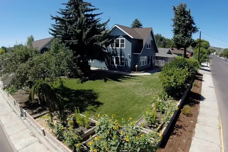 Large 5 bedroom, 3.5 bath with a master suite on each level, living room with beautiful stacked rock wood burning fireplace, family room and updated kitchen with granite counters and custom cabinets, detached garage with RV door and gas heater and bonus room above with heat and AC on a corner lot. This home has a lot to offer, many updates throughout, full basement, updated plumbing and on demand water heater and a beautiful yard. House has newer exterior paint.