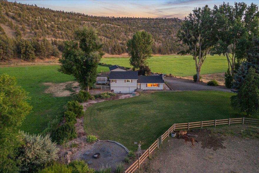 Tucked away on 20 private acres with 9.3 acres of irrigation producing an orchard grass mix, this fully remodeled 4-bedroom, 2-bath home offers space and the tranquility. Ochoco Creek meanders through the land, adding natural beauty and enhancing the peaceful outdoor lifestyle. 
The home boasts 2,688 square feet of thoughtfully updated living space, including a comfortable primary bedroom and an open-concept layout ideal for both quiet nights and lively gatherings. In addition to a large shop perfect for hobbies or equipment, there's also a hay shed on site to support your agricultural needs. 
The property includes two tax lots for added flexibility. You'll love the fully fenced pastures, and the direct access to public lands. Adjoining BLM land, it offers exceptional privacy and seamless access to miles of outdoor adventure. Close to Ochoco Reservoir, It's rural living yet close to town. 
Please see detailed features sheet.