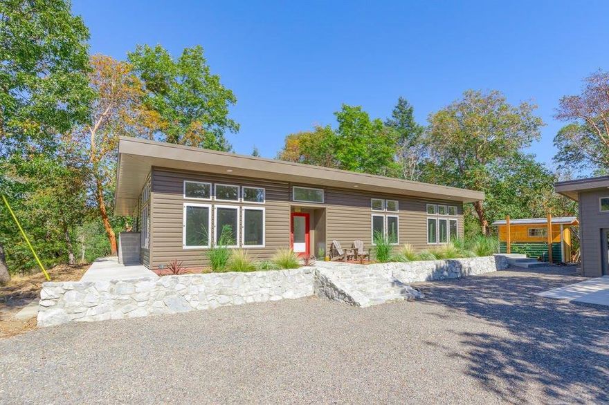 Here you can enjoy the contemporary lifestyle and still embrace quiet rural living. Only walking distance to the beautiful Historic town of Jacksonville. This modern, highly energy efficient 3 bedroom, 2 bathroom home sits on a lot surrounded by native vegetation, territorial views and plenty of privacy. Home was custom built featuring concrete floors, beautiful open floor plan, solid core doors for maximum noise reduction, double/triple pane Marlin aluminum windows. The kitchen is a cook's delight with top of the line appliances (Miele/Bosch) and new quartz counter tops(installed 3/20) New well drilled October 2020 producing 2.5 GPM. Sale includes 2 tax lots(3002 & 3003) both to be included in the sale, that will not be sold separately.