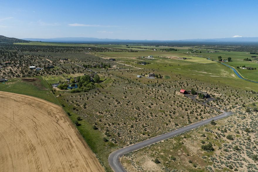 Hard to find new home site in a picturesque setting on 10+ acres located in a premier community of Powell Butte on the outskirts of Brasada Ranch. Live in the heart of Central Oregon with a plethora of recreational opportunities at your doorstep. Whether you're an outdoor enthusiast seeking hiking trails, mountain biking, skiing, fishing, or simply relishing in nature's wonders, this location is a haven for adventure seekers. Experience awe-inspiring sunrises and sunsets over the rugged mountain peaks from every corner of the lot & potential building sites. Whether you envision a luxury estate, a cozy cabin, or the perfect hobby farm, the possibilities are endless. The property presents endless possibilities and offers ample space to design and build your custom dream home, along with the opportunity to create a serene garden, outdoor entertainment areas & more! No HOA!
