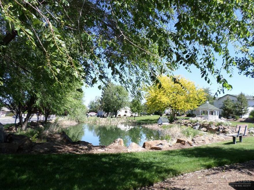 Beautiful 2 bedroom townhome in desirable Boulder Brook Subdivision. Large workable kitchen with maple cabinets and hard wood flooring. Very light & bright reverse living floor plan offers an open vaulted Great Room, a powder room for guests, a gas fireplace & a deck off the front for outdoor entertaining. Downstairs there are 2 large Bedrooms, the master has a large bathroom with tile counters & two closets for plenty of storage. Double car attached garage & forced air gas heat & A/C. Come and see!