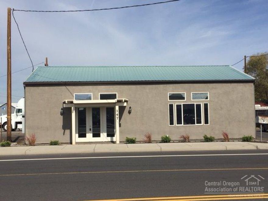 Don't miss this rare affordable owner-user opportunity for a commercial building in Redmond. Recently painted, highly visible with showroom & warehouse/shop/work area. Approximately 1,500 SF of finished showroom in front of building plus work/shop/storage are with overhead roll-up door in back of property. Located on a .24 acre lot 1/4 mile East of Highway 97, just east of the railroad crossing.