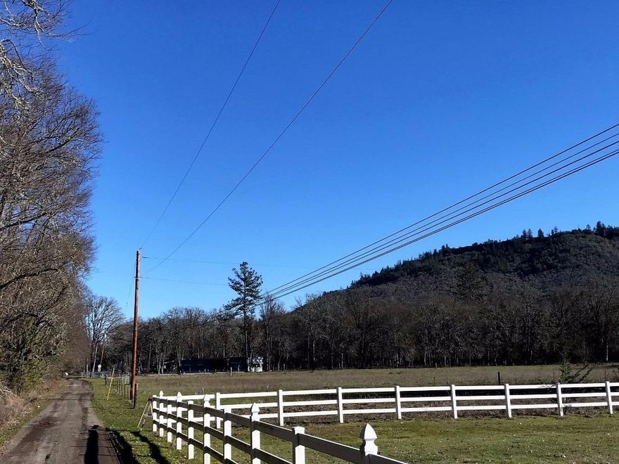 Prime Agricultural Property, 35.37 Acres Zoned EFU and Already Used to Grow! With end-of-the-road privacy and 3 gated entrances, this opportunity is going to excite you: the private location and daily wildlife give you a great country feel, while still being only minutes from all City conveniences. There is plenty of room here to build your dream home, and live in the older 4 bedroom, 2 bath manufactured home while you do. There's a large barn with 5 divided rooms for all your livestock needs, a 2-car detached garage for parking all the toys with workshop area ready for the handi-person. The views of the Table Rocks and sparkling seasonal creek running through ensure you'll be living the Oregon Dream. There are 2 large growing areas with room for much more! Don't miss this versatile property.