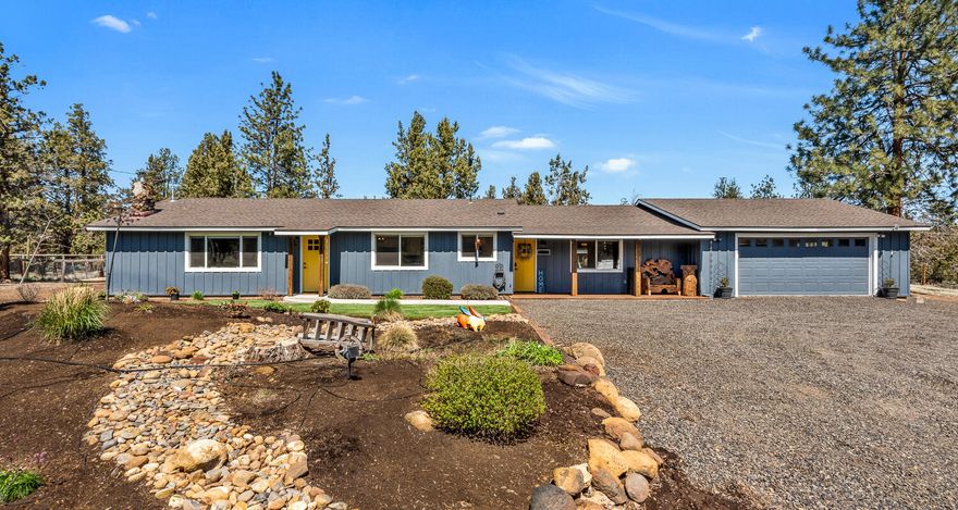 Updated single-level home in the Sisters area on over 2.3 fenced acres. The open floor plan showcases a living room with a vaulted exposed beam and wood inlay ceiling, natural rock surround wood-burning fireplace, and a refinished kitchen with quartz counters, updated cabinetry, and stainless steel appliances. A bonus rec room offers more room to entertain with a slider to the private, cross-fenced backyard, generous patio and updated landscaping with cost savings from a well fed sprinkler system. The property includes a detached insulated office with power and high-speed internet, a greenhouse, a refinished garage with extra storage and workshop space, whole house cooling with heat pump, and perimeter fencing with a ranch entry gate and horse stable with power. Pride of ownership is evident in the numerous property improvements, including new exterior and interior paint, carpet, window shades, wiring and lighting updates, power for RV hookup, and meticulous grounds maintenance.