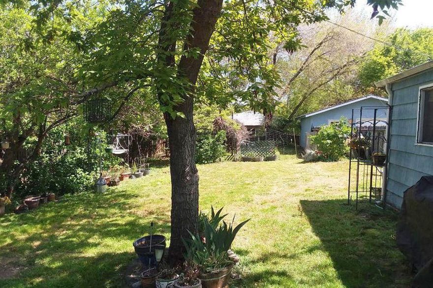 Great development potential.  This property is conveniently close to Southern Oregon University and Ashland High School and is near shopping and restaurants. The large, flat lot and R-2 zoning offer potential for several units. Check with the City Planning Department. The existing house has no foundation and needs other work. Any sale will need to be cash or lot only financing. There is a detached garage that appears to be in good condition. This property is being sold ''as is''.  Owner will consider short term financing for well-qualified buyer.