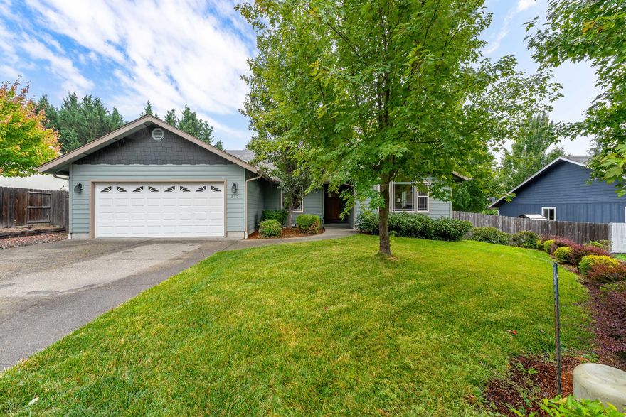 Tucked away on a quiet cul-de-sac, this meticulously maintained single-level home offers privacy, comfort, and style in one of Grants Pass's most desirable neighborhoods. Built in 2010 and thoughtfully cared for, this 3-bedroom, 2-bath beauty features gleaming wood floors, a great layout, and an abundance of natural light. The spacious kitchen boasts granite countertops, stainless steel appliances, and a convenient eating bar—perfect for entertaining or casual family meals. The primary suite is a true retreat with vaulted ceilings, double vanities, a large walk-in closet. Step outside to your private, fully fenced backyard surrounded by beautifully established trees, offering both serenity and space for gardening, play, or outdoor gatherings. Additional features include a two-car garage, RV Parking, indoor laundry, and a fantastic location close to town yet peacefully secluded. Move-in ready and truly turn-key—don't miss this opportunity!