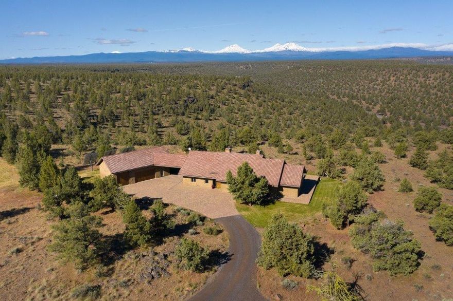 Not often does an opportunity to own 710 acres w/9 legal lots of record come along. Great development opportunity or just utilize existing parcels for private buildings sites or a family compound, all with amazing views. Spectacular Cascade Mt. views are the backdrop for the custom luxurious single level energy efficient off-grid home built to LEED standards. With views from every room this open floor plan has radiant heated floors, a custom stone fireplace, gourmet kitchen, high end appliances & custom details throughout. Master has a claw foot tub, double headed shower & more. 1248 sqft RV/garage, sink & heated floors, custom hot tub & expansive paver patio to enjoy all the views surrounding this home. BLM land to the west & east adding to the privacy of the home, truly making it your own private retreat. Removed from it all but still centrally located within 15 minutes of Redmond & Sisters. 2 parcels have Conditional Use Permits for building in place. CLA for more development info.