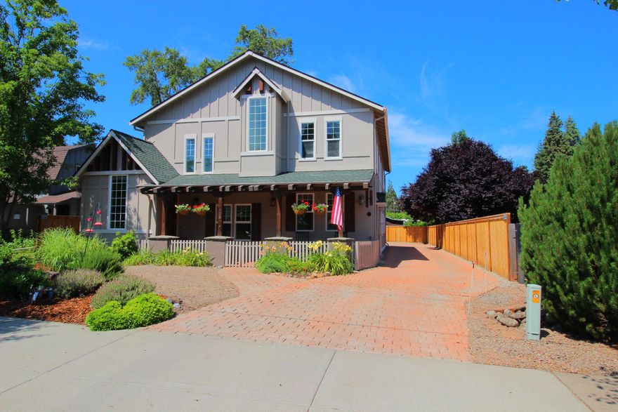 Majestic! This craftsman custom home is 'better than new'! Breathtaking inside and out. Incredible floor plan that includes all the bells & whistles. Gourmet kitchen is a must see! Travertine tile throughout, Australian Cypress wood upstairs, truly GORGEOUS. 3 gas fireplaces (one in primary bedroom!) All the primary living is on the main level, w/guest rooms & bonus room on upper level. Bonus room features custom murphy bed & is plumbed for water w/ a separate entrance (possibilities to convert to private additional quarters?)  Home is immaculate, must see this to truly take it all in.  4 car Garage includes 220 station for charging electric car. Home features 6160 Watt grid-tie solar system (reduced expenses on power bill!)  Great location in a lovely neighborhood! Just minutes from downtown and medical. It's a peaceful retreat of a home...where you can watch those hummingbirds as you enjoy a morning coffee out on the cozy cobblestone porch!