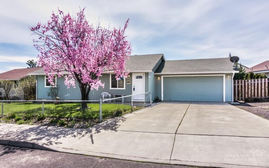 First Time Home Buyer / Investment Property! Wonderfully maintained and updated home with landscaped backyard privately guarded by mature trees and shrubs. The lilacs will amaze when in bloom and fresh apples from your own trees are a treat. This delightful home has an open floor plan with three bedrooms, two baths, two car garage, and hard to find RV Parking. The backyard deck is an extension of the home with a full size solar shade. DETAILS: 3 bed, 2 bath, 1008 sqft, .14 acres, built 1994. Updates include; solar tube, paint, water heater, painted cabinets, Antique Hickory Laminate, carpet, and vinyl. Parking; double garage, RV, concrete driveway. Exterior: Large backyard and deck with solar shade, shed (12x16), landscaped, fenced, sprinkler. Includes; murphy bed, refrigerator, washer, dryer, microwave, dishwasher, range/oven.