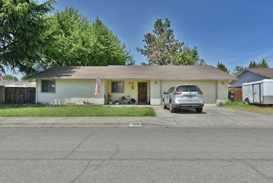 This family home is located in a quiet East Medford neighborhood. It is vacant and ready for a new owner. There's an open kitchen, walk in closet in master bedroom, fireplace, finished two car garage, RV parking, big private back yard with patio and garden area.