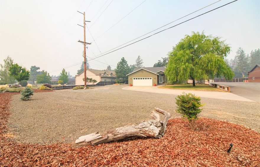 Well, here it is! Super clean and very rare home on the private Rogue Air strip. Upon touring this over 1,800 square foot home, all located on .54 acre lot, you will want to stay. This country home features 3 nice sized bedrooms, 2 full bathrooms, large open kitchen with tons of storage. The amazing rock wood stove center piece is perfect for heating the entire home during the winter months. The back yard is absolutely amazing. With a beautiful in-ground pool, pool house to make sure all the equipment is out of the weather, small bathroom and room for a sauna, what else does one need. There is PLENTY of parking for all your toys. Bring your plane or enjoy watching those around fly from your front window!