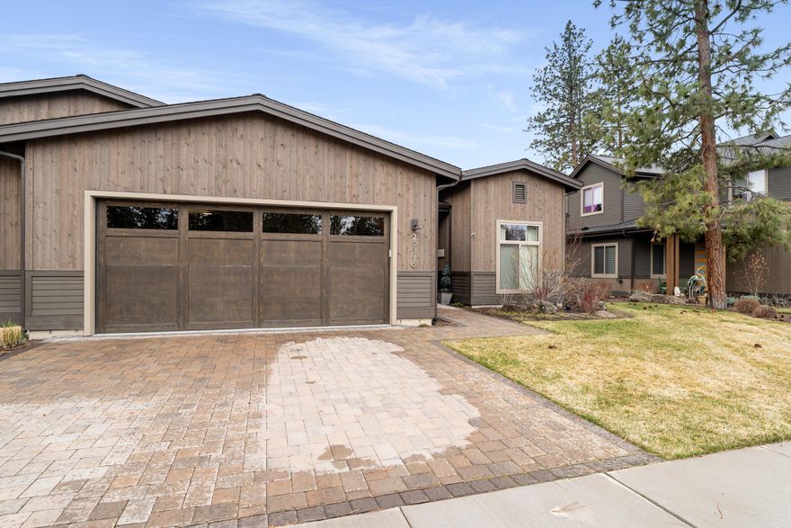 Beautifully finished home in the 1925 Townhomes subdivision at Bend Golf Club. Features include 3 bedrooms, 2 and a half bathrooms, a large great room, 32x16 paver patio with bench seating surround, gas firepit, gas grill connection, and an invisible fence on the side yard. All closets including the pantry have custom organizers in them. The kitchen includes Jenn Air appliances, a dry bar and a wine fridge. The main bedroom closet has a 3-tiered system for maximum storage while the main bathroom has heated floors and an added solatube for light. The garage has New Age cabinets and shelving as well as an added storage loft above the golf cart parking spot.  A storage area has been built in the attic including a fold down ladder for access. A new solar system was installed in 2023 by Infinity Solar. Custom drapes in the dining area and motorized shades in the living room are also included.  The garage is equipped with a 240v receptacle for EV chargers.