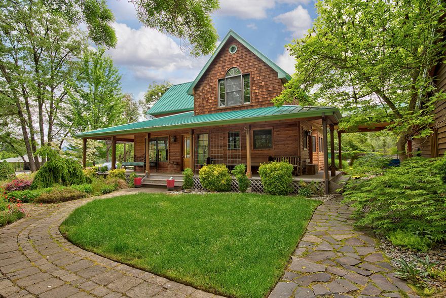 A Horse lovers dream! Chateau style home with 3 bedroom/3.5 baths, master downstairs. Beautiful woodwork throughout (red oak floors/maple cabinetry in kitchen and more). Mother-in-law quarters off detached garage (there's an additional detached two-car garage as well. Home is set back from the road down a paved driveway in secluded country quietude.
Covered porch and patio areas for outdoor entertaining with lovely landscaping around home. Property is  nearly 46 acres with everything an equestrian could want: large hay field and 17 acres of water rights, 80x230' arena with covered steel arena inside (approx. 80x90) – all wired with sound and lights, raised Center Aisle (RCA) barn with 3 stalls, wash rack, feeder, and tack room. Shed row barn with 4 stalls and 3 paddocks.
Property powered via solar and electric. Owner will consider owner carry offer with half down. Irrigation is in use – equipment included.