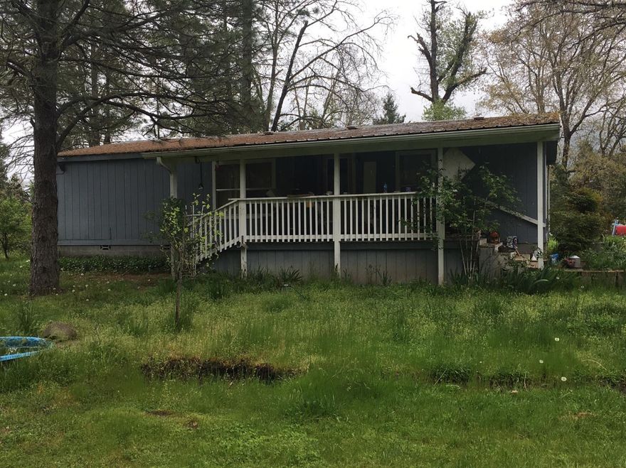 What a wonderful setting this level 3 .76 acres with nicely treed acreage , Great Well. room for everything raised garden beds and is fenced as well. Three bed room two bath manufactured home (FYI Twice Moved).