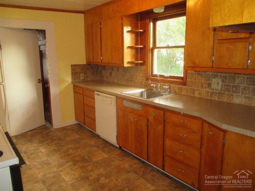 Don't miss this older farmhouse style home that has new kitchen counter tops,tile back splash,large stainless sink,new vinyl flooring in kitchen,laundry room and hallway.Refinished wood floors upstairs,fresh paint throughout the main level on the home. Enjoy sitting in the window seat. Close to town, park, schools and library.Ready for your family to enjoy.Home is in the hundred year flood plain.