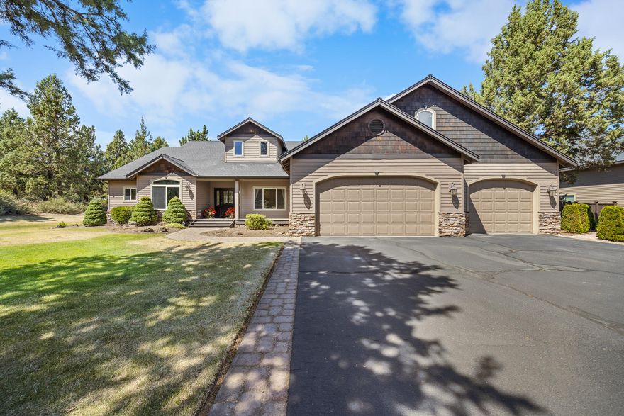 Single level home located near Bend's popular Pine Nursery Park! This stunning home on 2.47 acres offers comfort, space & convenience. The open concept living area is designed for gathering, entertaining, or enjoying cozy mornings next to the gas fireplace. The kitchen features a large eating bar & ample counterspace for any home chef. The large primary suite features a see-through glass fireplace, soaking tub, step-in shower, & double vanity. Three additional generously sized bedrooms are located at the opposite end of the home, providing flexibility for guests or family. This property provides a full RV hookup, 3-car garage & 2 detached finished shops with room for your RV, boat, or other recreational toys.  Electricity is powered by the sun via a 10.08 kw solar system.  The property offers a serene, park-like setting with a private backyard entertainment area. Don't miss this rare combination of location, livability & space in the heart of Bend.