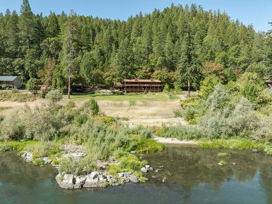 Stunning Rogue Riverfront Lodge-Style Home in the Desirable Wilderness Town of Galice! Magnificent River Frontage & Unimpeded Views of the River & Surrounding Mountains make this a Shining Star in the Arena of Riverfront Homes. Light & Bright Home w/Tons of Windows & Huge Full-Length Upper & Lower-Level Decks. Great-Room Floor Plan w/Vaulted Ceilings, Beautiful Kitchen w/Hickory Cabinets, Granite Counters, & Stainless Appliances. Huge Main-Level Master Suite offers French Doors w/Direct Deck Access, & Bath w/Dual Vanities. Lower Level Bedrooms are Impressive & Nicely Separated, w/Full & Half Bath, Laundry & Deck Access! Two Car Garage, Plus Carport. Super-Cute Separate Studio Cabin w/Full Facilities & Large Deck! Concrete Drive, Patio w/Hot Tub, & Huge Parking Area! Level Land that just fades into the River. Access to Thousands of Acres of Government Land, Trails, Creeks & the Rogue Wilderness! Just down from Galice Resort offering River Adventures & Live Music in Summer! Superb VRBO!