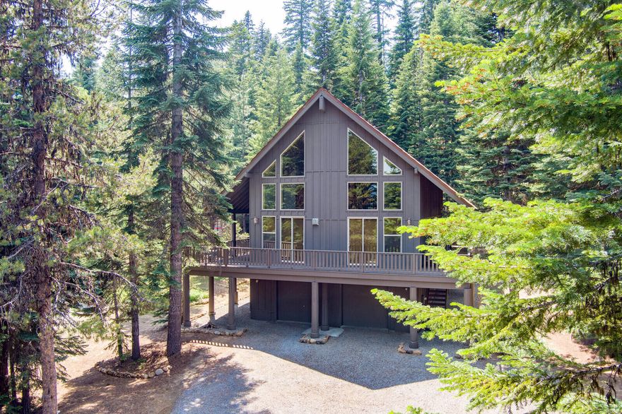 This is an amazing Southern Oregon Retreat! The LakeWoods Village Subdivision is just 4 miles to the
south end of Lake of the Woods and 7 miles to the Resort. This beautifully built custom home sits on
one full acre with amazing trails around LakeWoods Village,and a short distance to the Pacific Crest Trail. The home has 3 bedrooms, 4 full bathrooms, upstairs loft, and downstairs media/family room. There is an oversized 900 sq ft tandem garage for boats, trailers, and kayaks. The 32 ft ceilings in the main living room, kitchen and dining area and gorgeous floor to ceiling windows capture the mountain views. There are all new wide plank hardwood floors, and new granite counters in the kitchen. The craftsmanship and attention to the details and design in the home is fabulous. The master bedroom has vaulted ceilings and a large double vanity master bath w/walk-in shower, and large walk-in closet. The 1600 sq ft wrap around deck is wonderful for entertaining year-round. A must tour home!