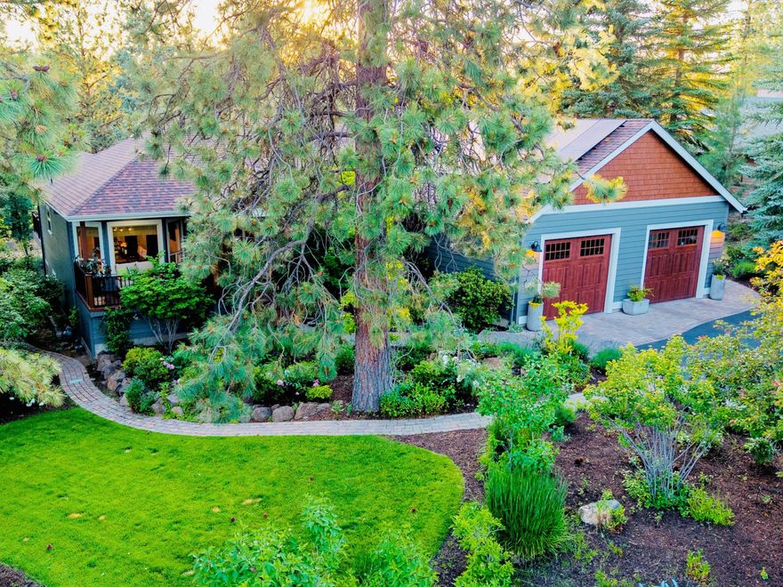 This beautifully updated home on the 7th fairway of Awbrey Glen Golf Club combines refined living with stunning golf course views in one of Bend's premier west side neighborhoods. Mature landscaping, paver pathways, a water feature, and expansive Trex decks create privacy and outdoor enjoyment. Inside, hardwood floors, abundant windows, and a chef's kitchen with quartz counters, luxury appliances, and large island set the tone. The primary suite offers two walk-in closets and a spa-like Carrara marble shower. Two ensuite bedrooms, dining room, a private office, and half bath complete the main level. The lower level adds a bonus room, private guest suite, with its own entrance. Recent updates—roof, solar, furnace, EV charger, exterior paint—provide peace of mind. Awbrey Glen is an amazing golf course community with trails, tennis, and golf, close to shops, restaurants, and the best of Bend's west side living. You will love living in this beautiful home!