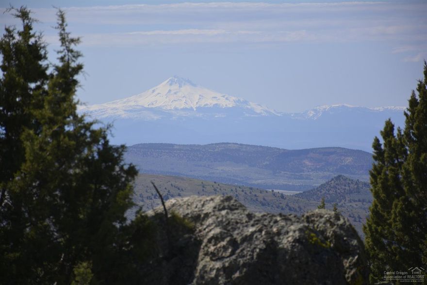 Historic ranch & timber property. This is a spectacular site for secluded vacation lodge or full-time residence close to Madras Panoramic vies of Cascade intermediate terrain. Natural grazing land, rolling hills, dense forested areas and rock quarry. Pioneer homestead location has weathered corrals, building remnants, poplars, fruit trees and a natural mountain spring nearby. Abundant wildlife including native elk, deer cougar and turkey. Property boarders the historic Hay Creek Ranch