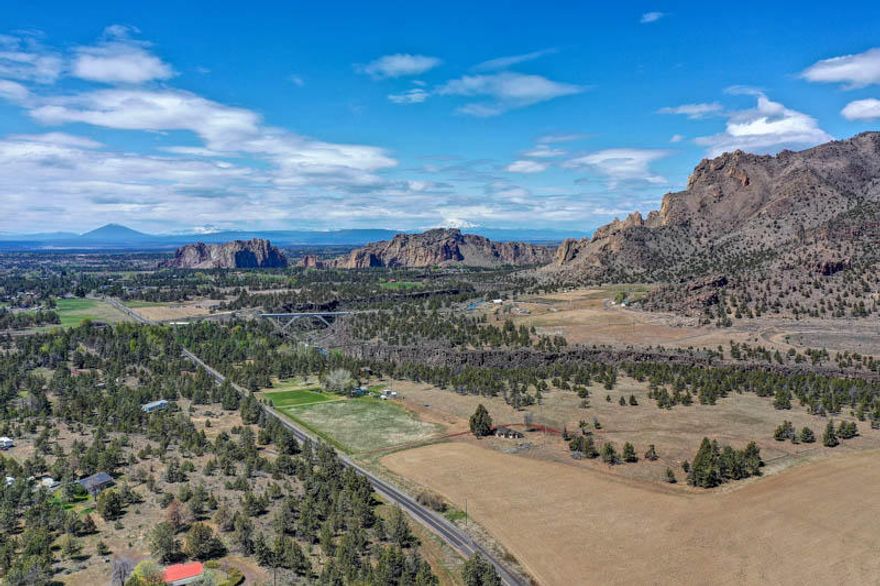 INCREDIBLE SPECTACULAR SMITH ROCK VIEWS!  Come and enjoy the peace and quiet of this property. Nice Park like setting with a fenced orchard and garden area.  There is a small shop and wood shed with a cement RV parking pad. Also a nice chicken coop that could also be used as a dog run. The home has had a few recent updates, New roof April/May 2020, New septic 2 years ago, newer vinyl windows, Exterior painted within the last couple years. The home is on community water @ $35.00 a month. COME ENJOY EVERYTHING THIS PROPERTY HAS TO OFFER!