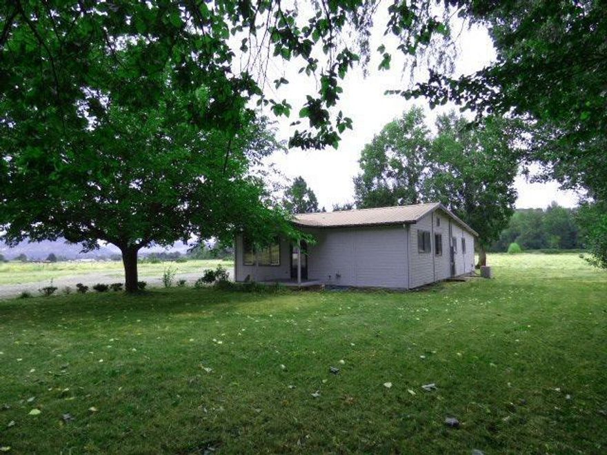 Country feel. Close by: This property is located on a 5 acre parcel of usable land, in a private setting with beautiful views of the Table Rock and plenty of room for animals and to grow a garden. This 3 bdrm/2bth home was remodeled in 1992 and recently updated with new carpet, vinyl and paint. Features an open floor plan with kitchen that opens to dining room and living room, laundry room off the kitchen and a large 1335 sqft detached workshop. Property is in as-is condition.