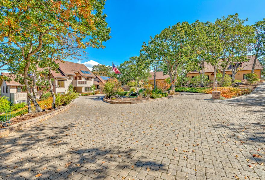 Only 9 minutes from Downtown Ashland, this rural estate features 3 bedrms, 3.5 bathrms, 5375 sq ft, 2+ TID irrigated acres, a customized in-ground pool, detached guest house with garage, detached RV garage, large bass pond filled year-round, and has amazing views of Emigrant Lake & the surrounding Rogue Valley. The main house features 2 living rooms, formal dining room, 2 offices, library, large laundry room, & a walk-in vault. Chef's kitchen with granite countertops, large island, high-end appliances & a walk-in pantry. Master bathrm contains a sauna, hot tub, walk-in closet, full bathrm. The detached 3-door RV garage can fit every vehicle your heart desires & includes a full bathrm. The detached guest house comes 2 full bathrms, workout room, large bedrm & kitchen. Both the house and apartment have backup propane generators. Property has a newer well and both furnaces in the main house were recently replaced. Sit back in the heat controlled pool & watch an amazing sunset.