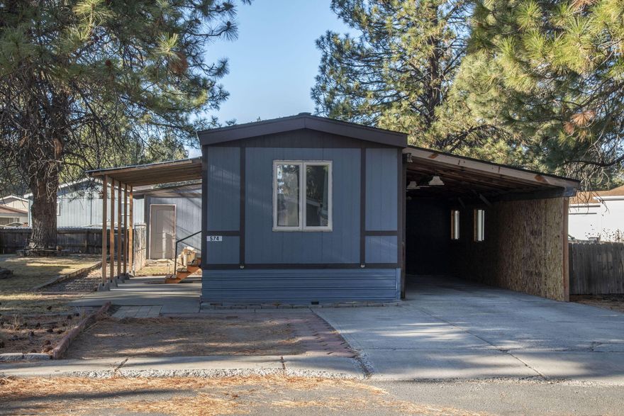 Located on a hard-to-find double lot with a grass area, private deck, and fenced space. Plenty of parking and outside storage. Inside, you'll find 3 bedrooms and two full baths, a kitchen island with storage, and a laundry nook. Space rent includes snow removal, clubhouse access, play court area, & maintenance of common areas. All occupants must undergo park approval, which includes a background & credit check. Sold AS-IS. This home is in a Park on leased land. Mobile Only for sale.